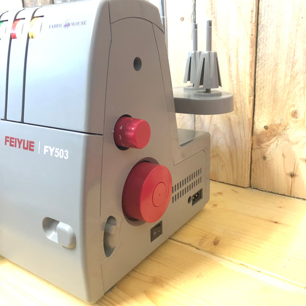 Feiyue FY503 arcade machine with red control knobs on a wooden background