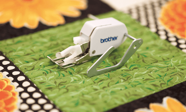 Brother F016N quilting guide shown fitted to a walking foot — walking foot not included
