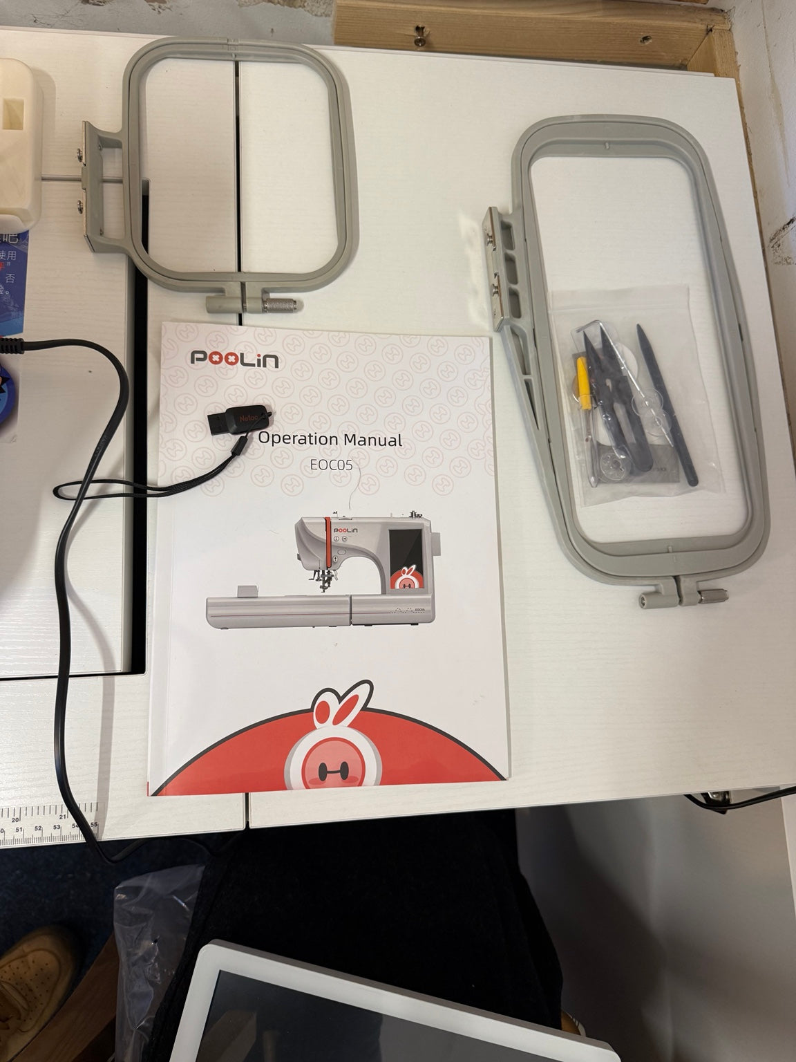 Included embroidery hoops, manual, USB stick and accessories