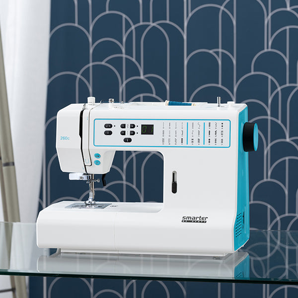 Pfaff Smarter 260c sewing machine on a glass table